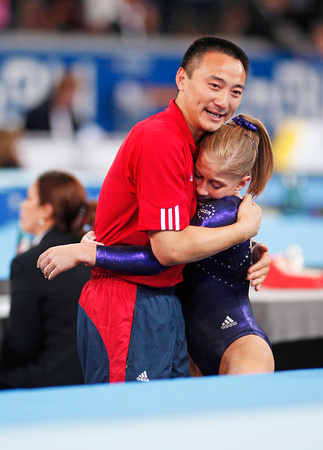 Shawn Johnson gets a hug from her coach