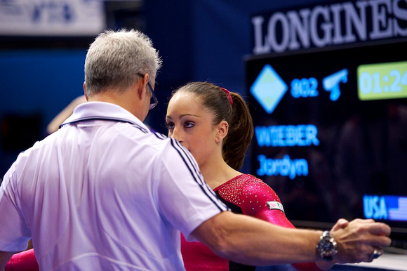 Jordyn Wieber gets some last minute advice from her coach